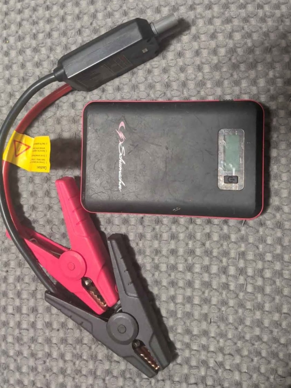 Schumacher Lithium Ion Portable Jump Starter Pack in Black and Red